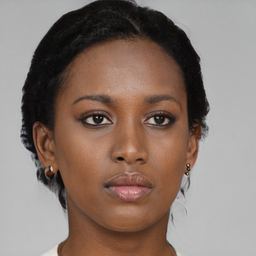 Neutral black young-adult female with short  brown hair and brown eyes