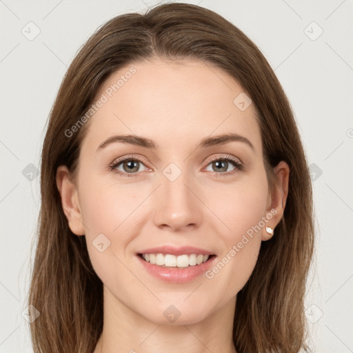 Joyful white young-adult female with long  brown hair and grey eyes