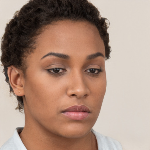 Neutral white young-adult female with short  brown hair and brown eyes