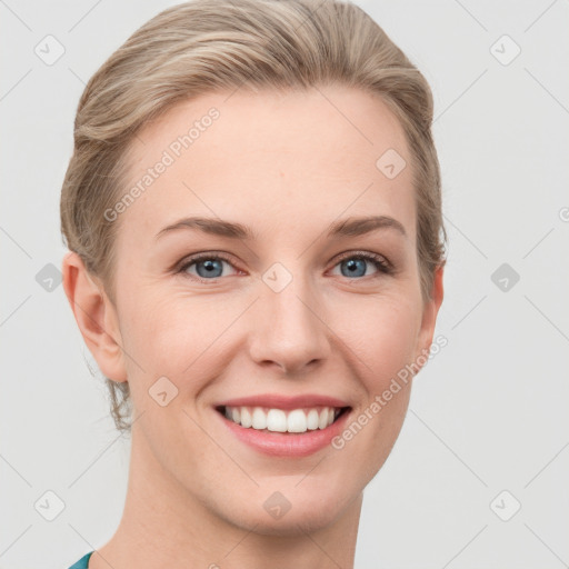 Joyful white young-adult female with medium  brown hair and blue eyes