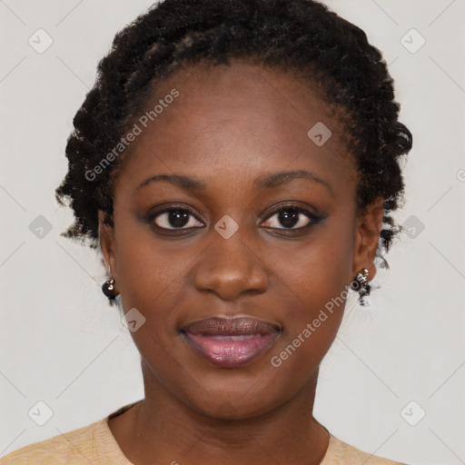 Joyful black young-adult female with short  black hair and brown eyes