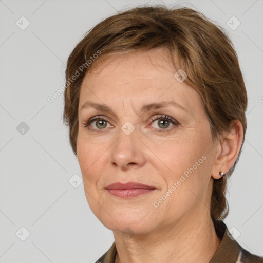 Joyful white adult female with medium  brown hair and grey eyes