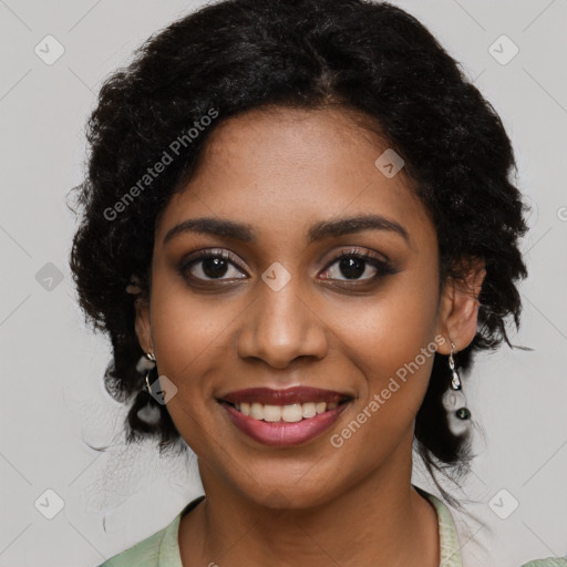 Joyful black young-adult female with medium  black hair and brown eyes