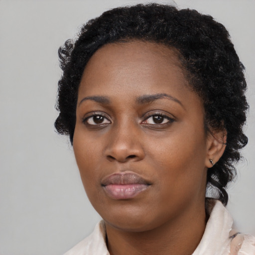 Neutral black young-adult female with short  black hair and brown eyes