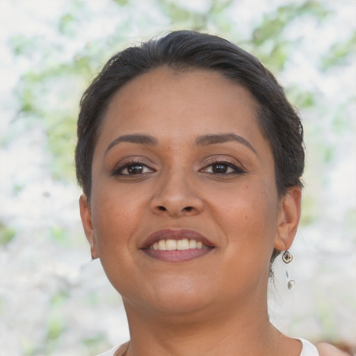 Joyful latino young-adult female with short  brown hair and brown eyes