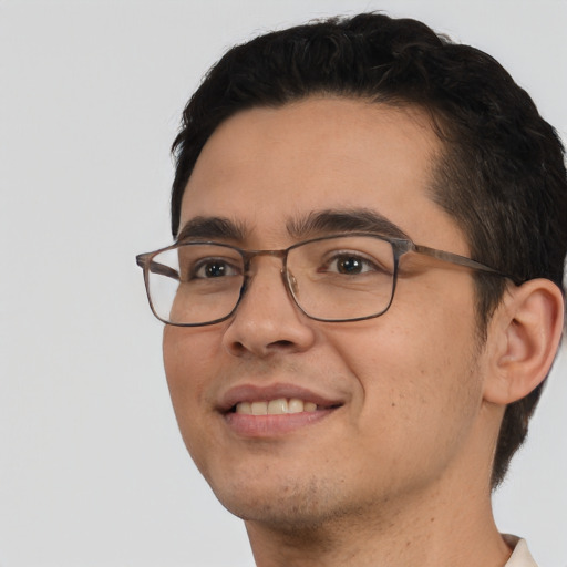 Joyful white adult male with short  black hair and brown eyes