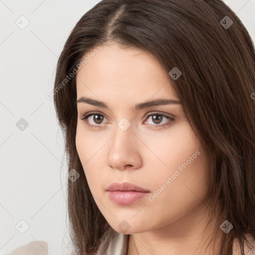 Neutral white young-adult female with long  brown hair and brown eyes