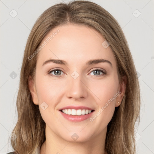 Joyful white young-adult female with long  brown hair and green eyes