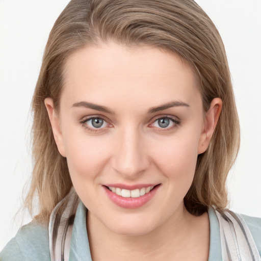 Joyful white young-adult female with medium  brown hair and blue eyes