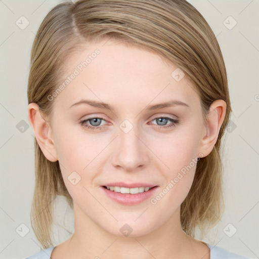 Joyful white young-adult female with medium  brown hair and blue eyes