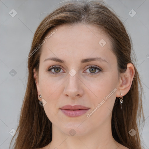 Joyful white young-adult female with long  brown hair and grey eyes