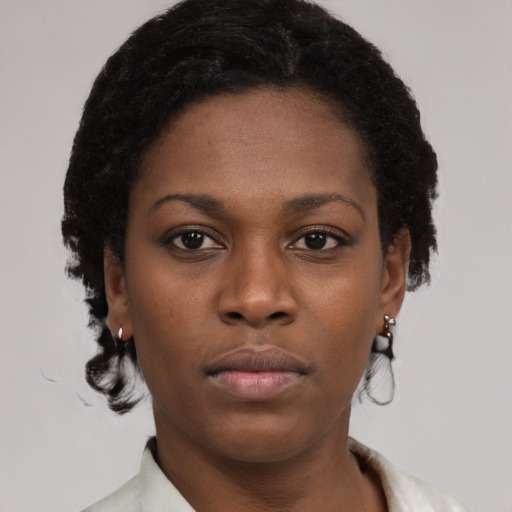 Neutral black young-adult female with short  brown hair and brown eyes