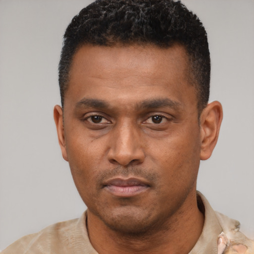 Neutral black young-adult male with short  black hair and brown eyes