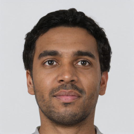 Neutral black young-adult male with short  black hair and brown eyes
