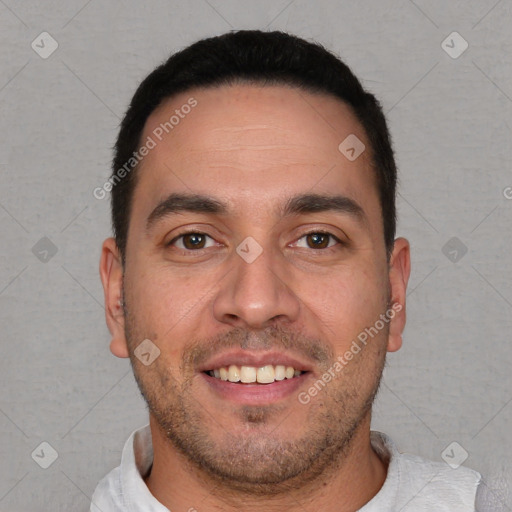 Joyful white young-adult male with short  black hair and brown eyes