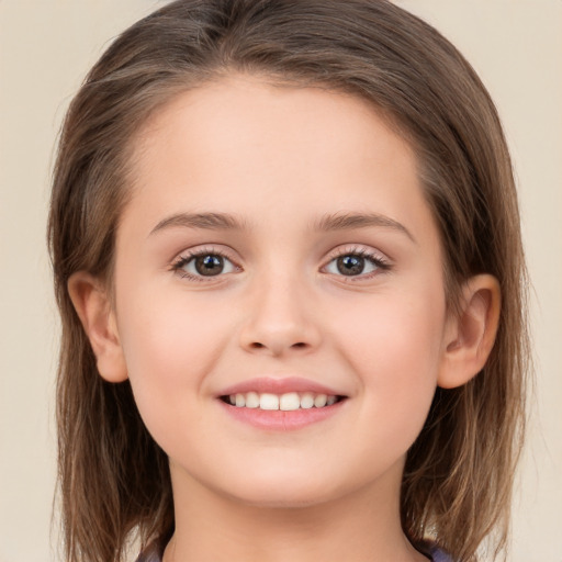 Joyful white child female with long  brown hair and brown eyes