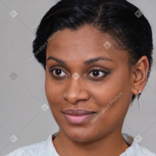 Joyful black young-adult female with short  brown hair and brown eyes