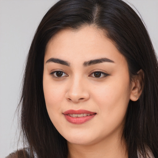 Joyful asian young-adult female with long  brown hair and brown eyes