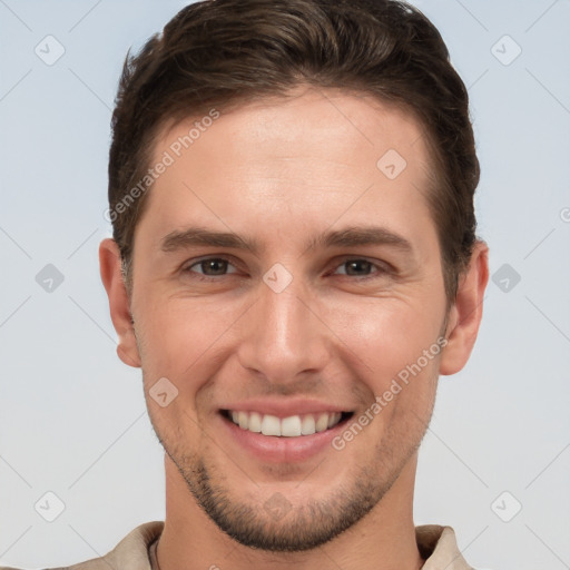 Joyful white young-adult male with short  brown hair and brown eyes