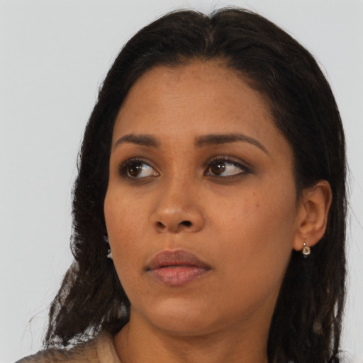Neutral latino young-adult female with long  brown hair and brown eyes