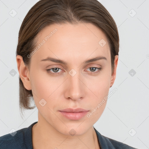 Neutral white young-adult female with medium  brown hair and grey eyes