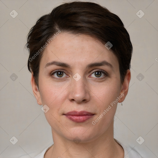 Joyful white young-adult female with short  brown hair and grey eyes