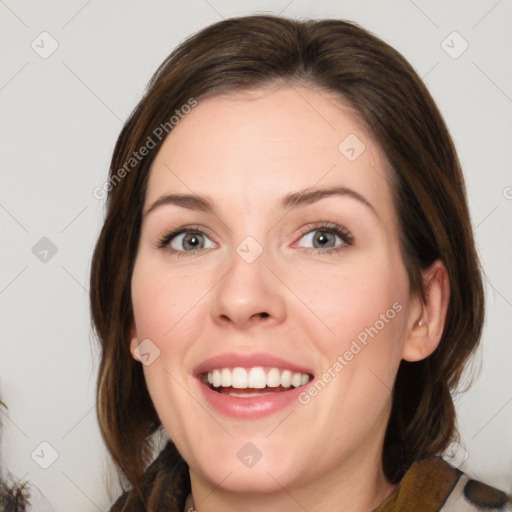 Joyful white young-adult female with medium  brown hair and green eyes