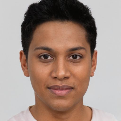 Joyful latino young-adult female with short  black hair and brown eyes