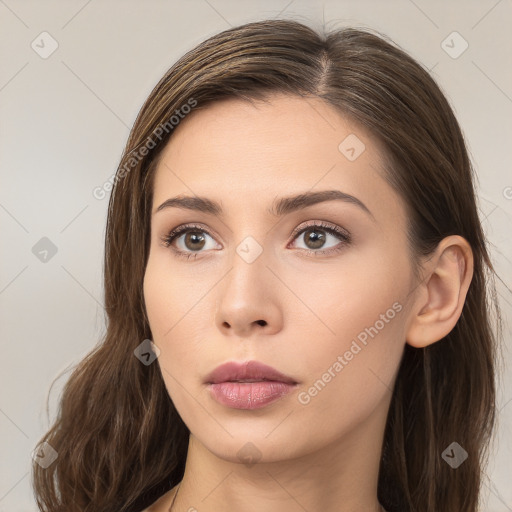 Neutral white young-adult female with long  brown hair and brown eyes