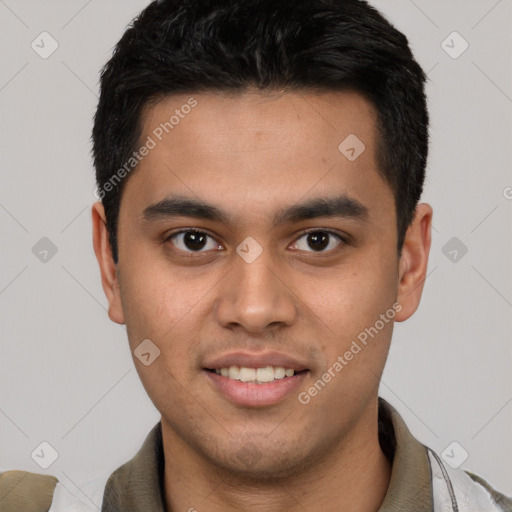 Joyful latino young-adult male with short  brown hair and brown eyes