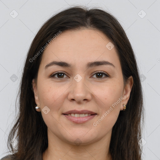 Joyful white young-adult female with long  brown hair and brown eyes