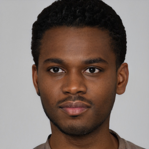 Neutral black young-adult male with short  brown hair and brown eyes