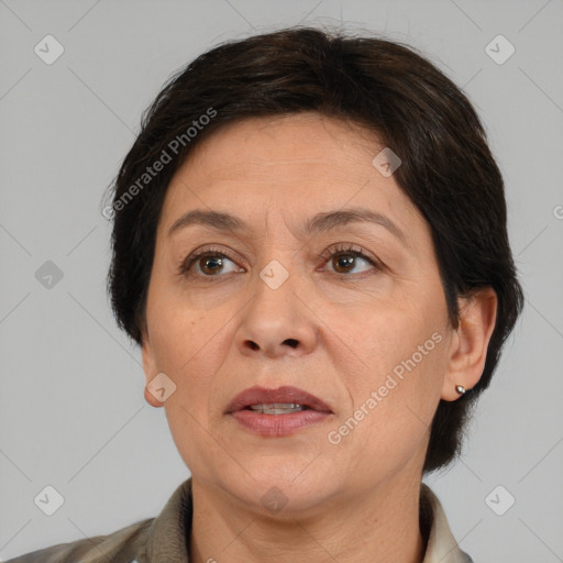 Joyful white adult female with short  brown hair and brown eyes