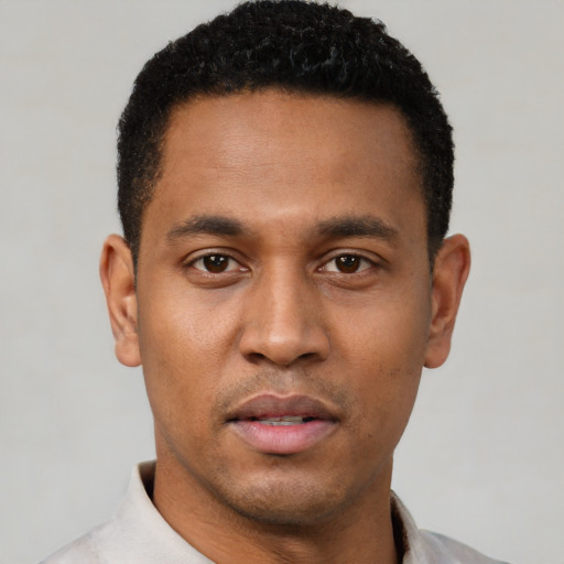 Neutral latino young-adult male with short  black hair and brown eyes