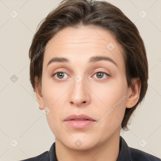 Neutral white young-adult female with short  brown hair and brown eyes