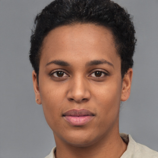 Joyful latino young-adult female with short  black hair and brown eyes