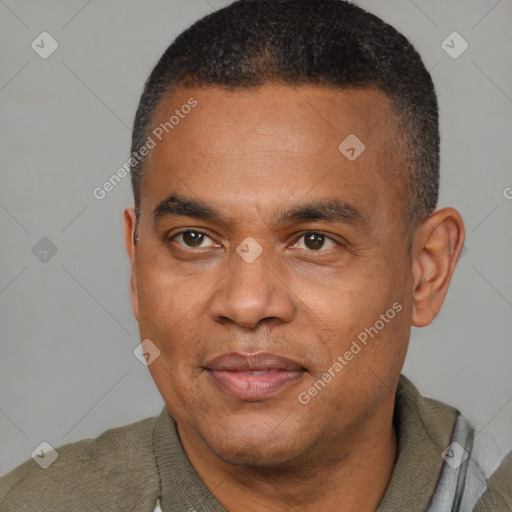 Joyful latino adult male with short  brown hair and brown eyes