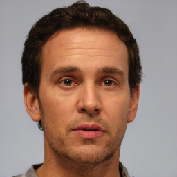 Neutral white adult male with short  brown hair and brown eyes