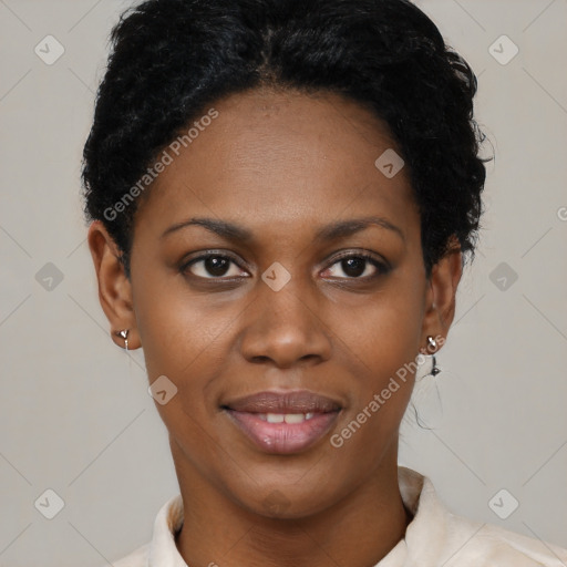Joyful black young-adult female with short  black hair and brown eyes