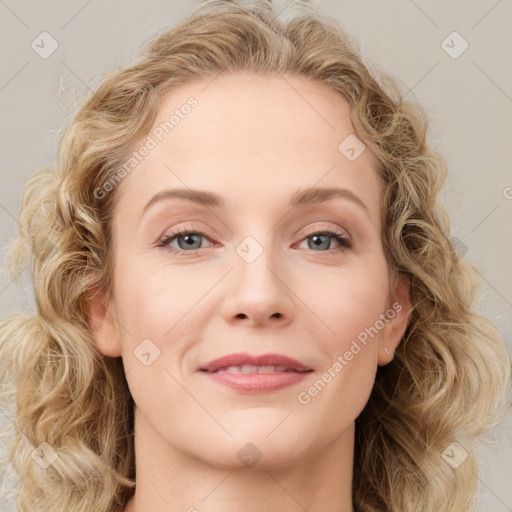 Joyful white young-adult female with medium  brown hair and blue eyes