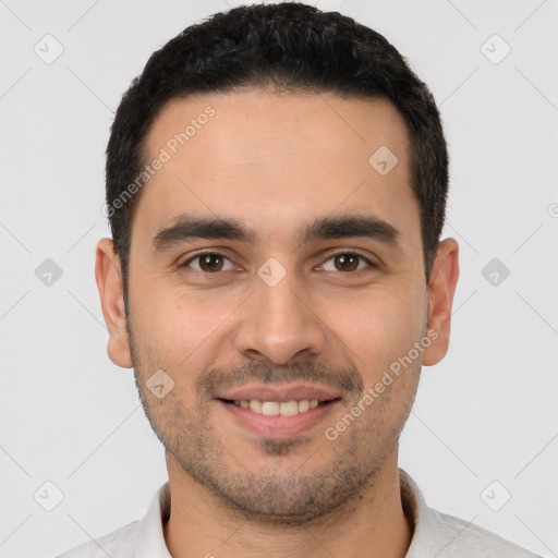 Joyful white young-adult male with short  black hair and brown eyes