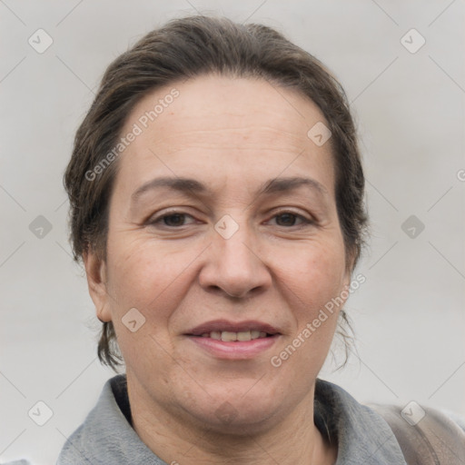 Joyful white adult female with short  brown hair and brown eyes