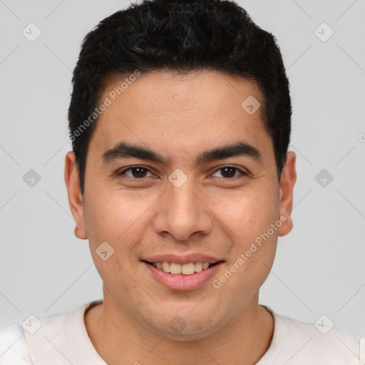 Joyful latino young-adult male with short  brown hair and brown eyes