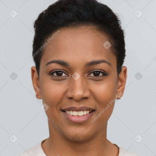 Joyful black young-adult female with short  black hair and brown eyes