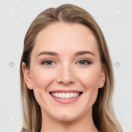 Joyful white young-adult female with long  brown hair and blue eyes