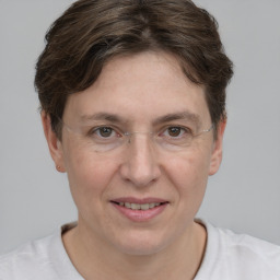 Joyful white adult female with short  brown hair and brown eyes