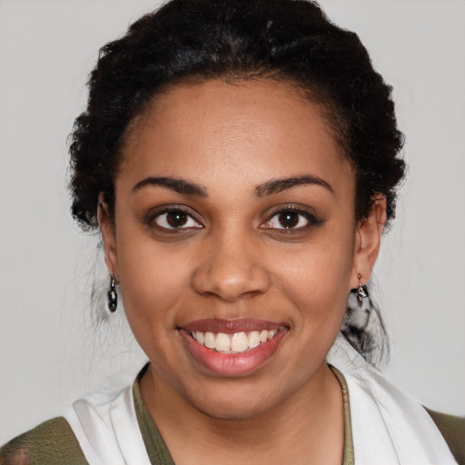 Joyful latino young-adult female with short  black hair and brown eyes