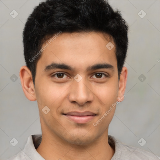 Joyful latino young-adult male with short  brown hair and brown eyes