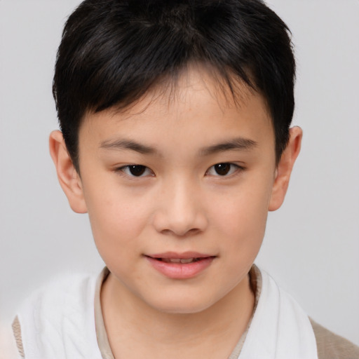 Joyful asian child female with short  brown hair and brown eyes