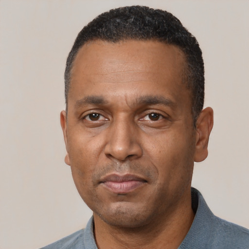 Neutral black adult male with short  black hair and brown eyes